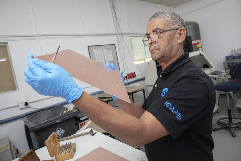 trax employee examining material